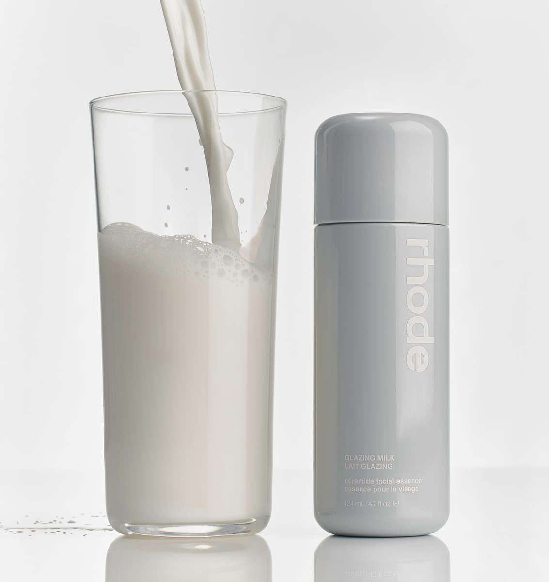 glazing milk next to a glass of milk
