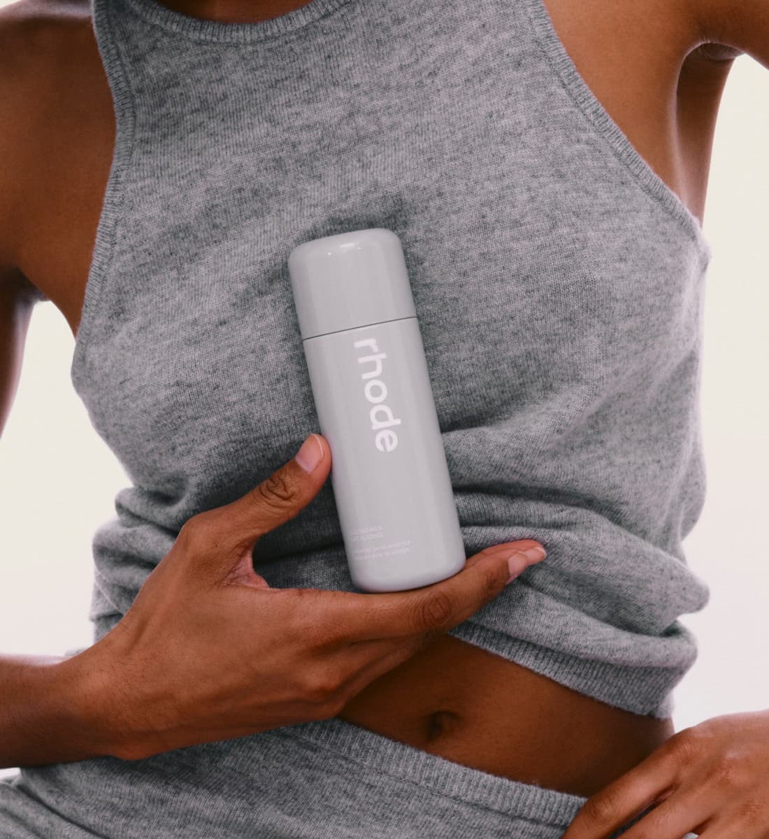 model holding a glazing milk bottle