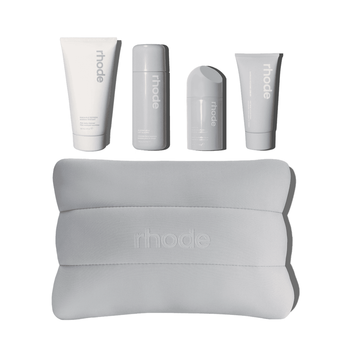 The rhode kit includes Pineapple Refresh, Glazing Milk, Peptide Glazing Fluid, Barrier Restore Cream bundled up in a rhode bubble bag.