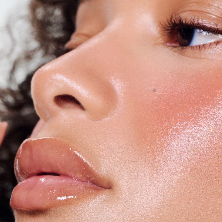 model wearing peptide lip tint in salty tan