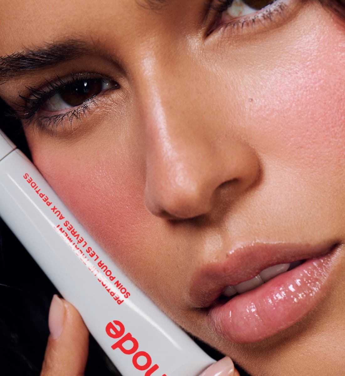 model with peptide lip treatment strawberry glaze