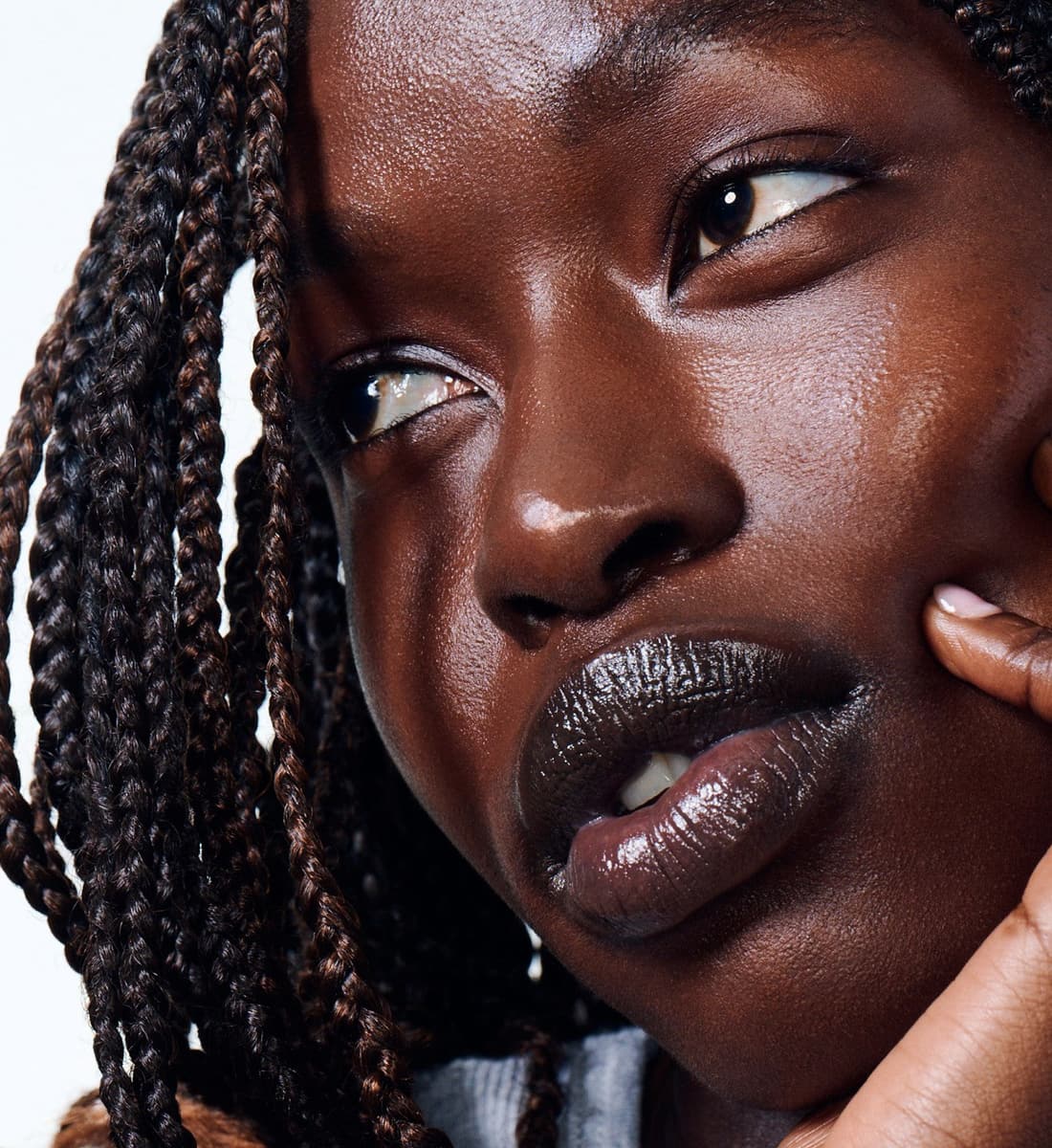 model wearing peptide lip treatment in strawberry glaze