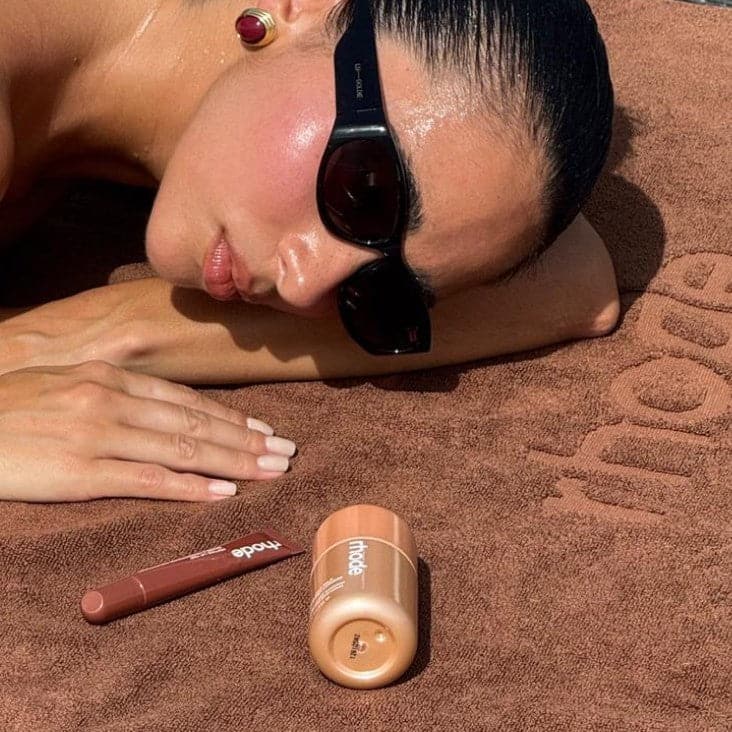 georgina with highlight milk and peptide lip tint honey mango